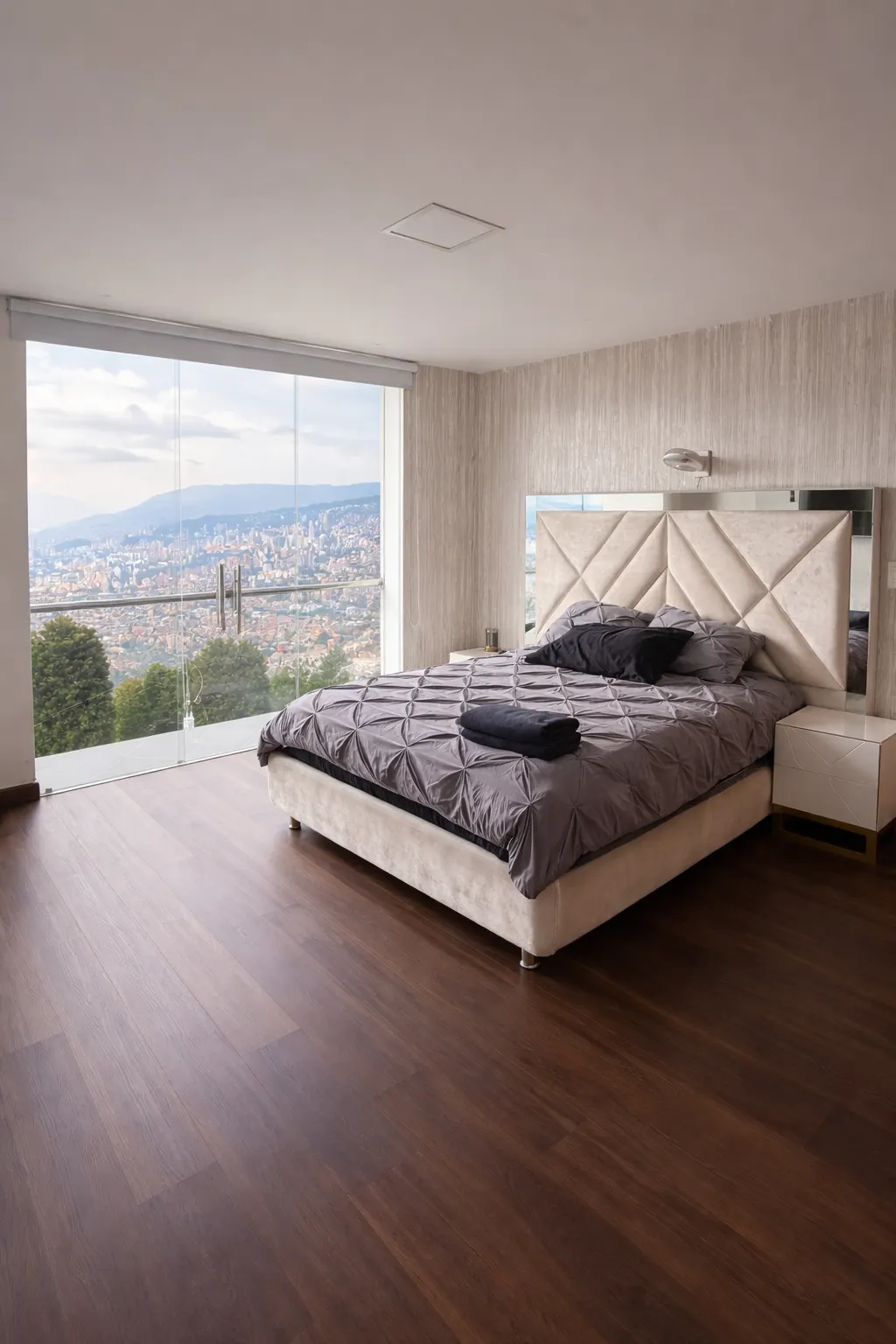 Medellín valley view through the windows of a Nomad Finca bedroom