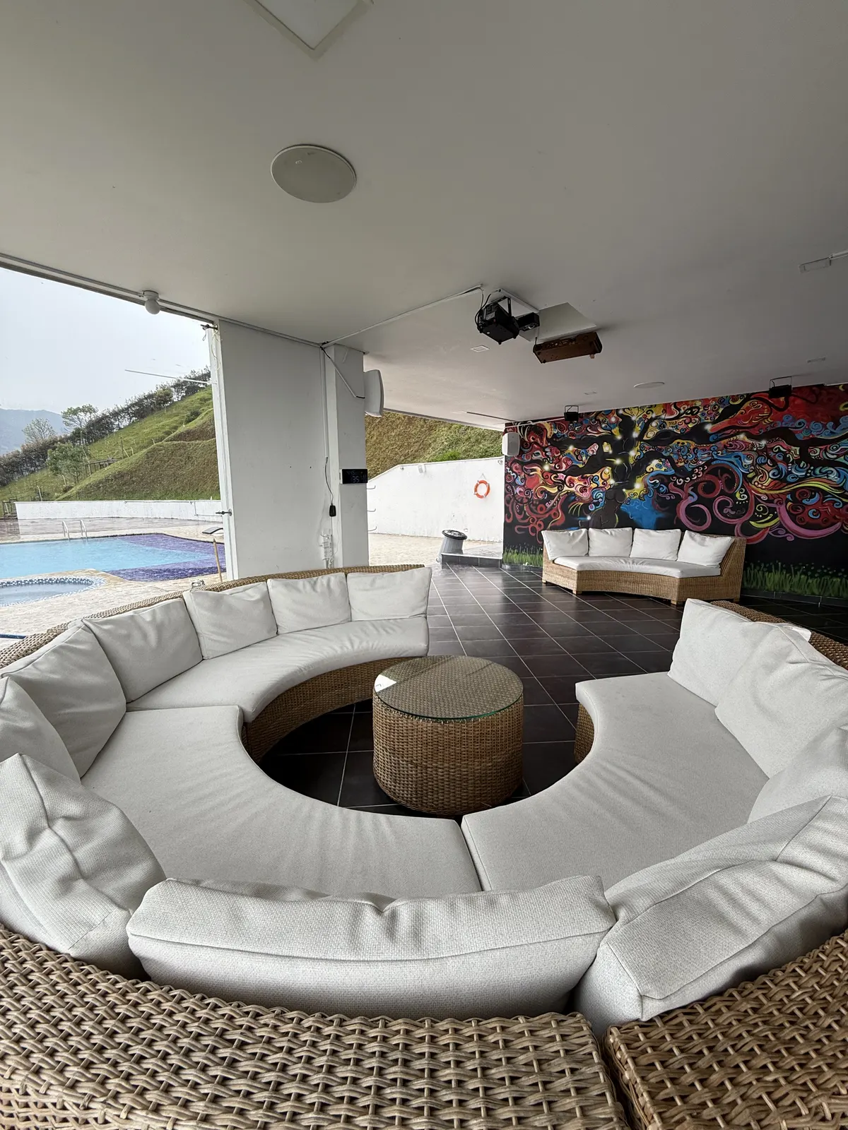 The covered lounge beside Nomad Finca's pool and music area