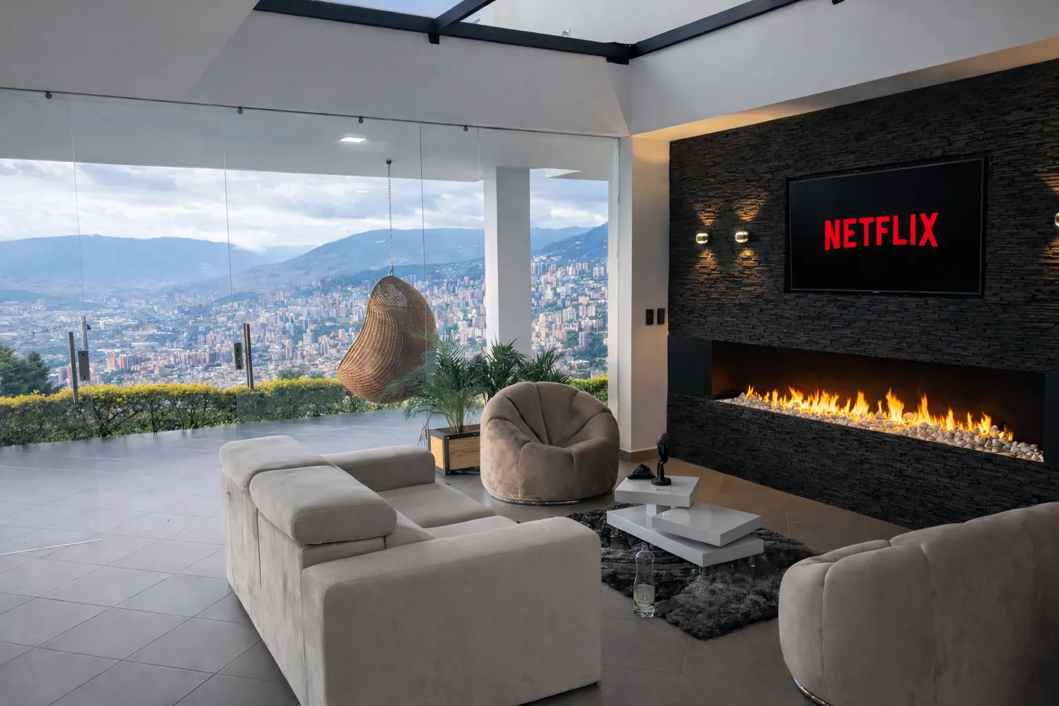 Valley skyline seen through the glass-walled living room at Nomad Finca